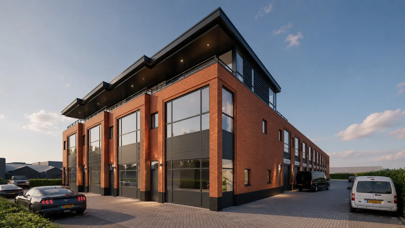 Hoekaanzicht van de nieuwbouw bedrijfsunits No Limits Noordwijk met bakstenen gevel en glazen puien